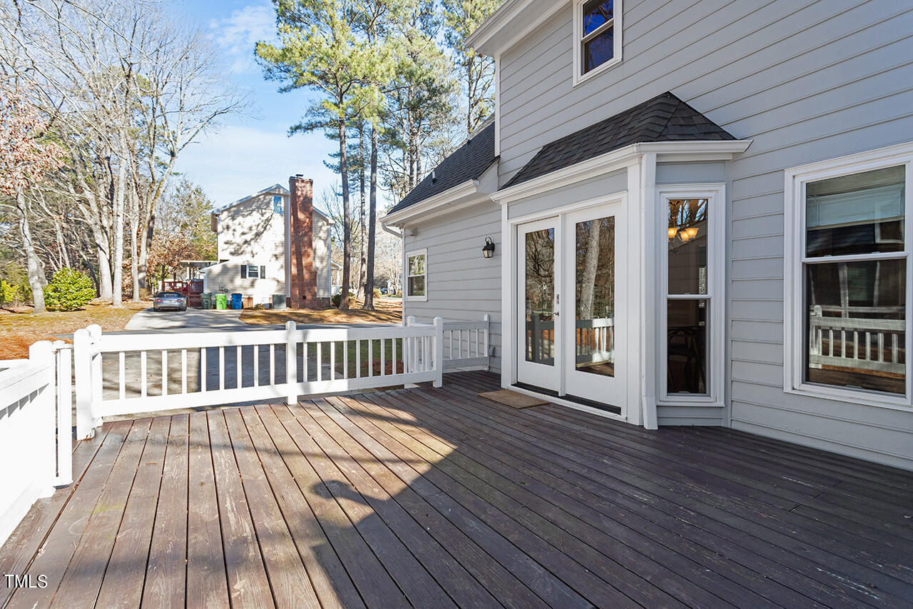 6933 Sandringham Drive Raleigh, NC 27613 - Photo 24 of 30 a view of a house with a deck