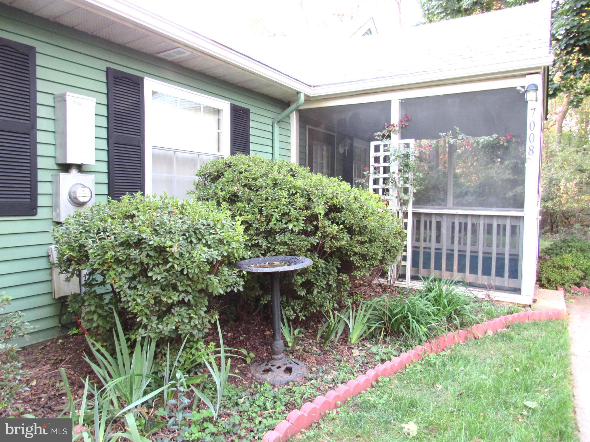 7008 Basswood Road Frederick, MD 21703 - Photo 3 of 26 a view of a backyard with plants