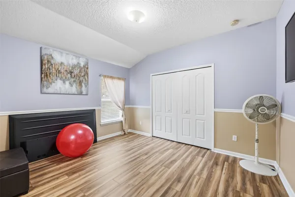 a view of a livingroom with wooden floor