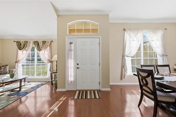 a view of a livingroom with furniture and hardwood floor