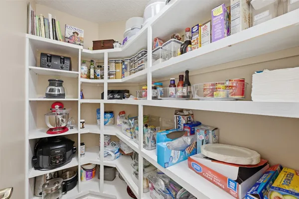 a room with furniture and a book shelf