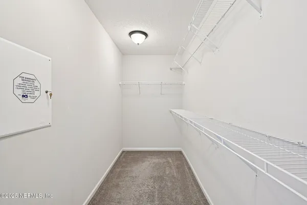 a view of small space with racks on the wall