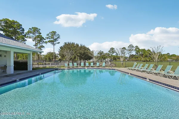 a view of a swimming pool with a lake view