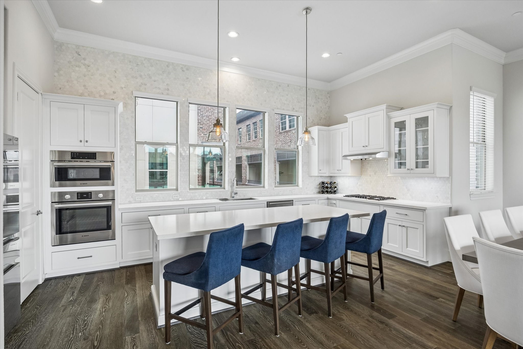 2727 Maxroy Street Houston, TX 77007 - Photo 15 of 46 a kitchen with stainless steel appliances kitchen island granite countertop a table chairs sink and cabinets