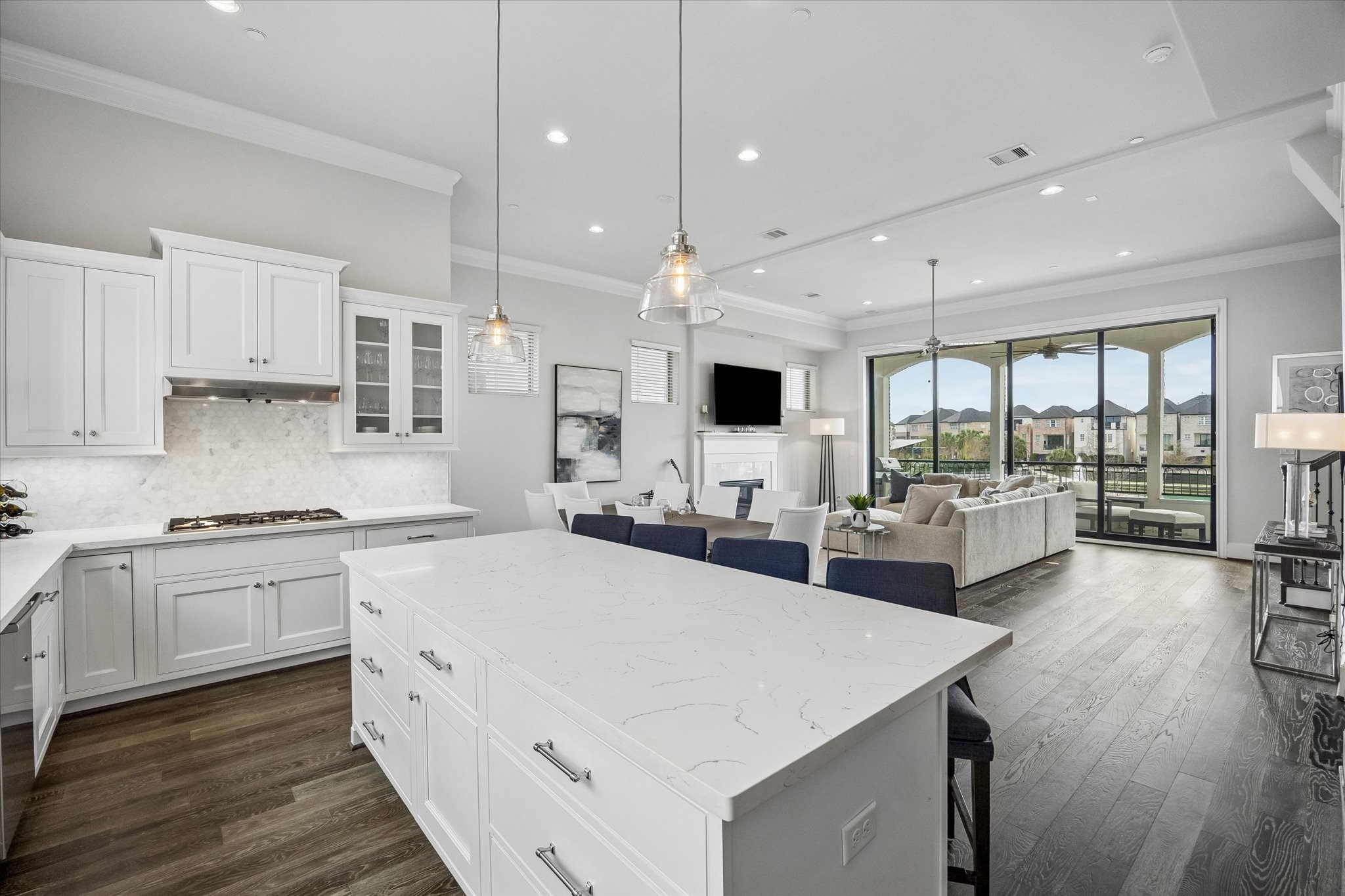 2727 Maxroy Street Houston, TX 77007 - Photo 16 of 46 a large kitchen with kitchen island a large counter top space a sink stainless steel appliances and cabinets