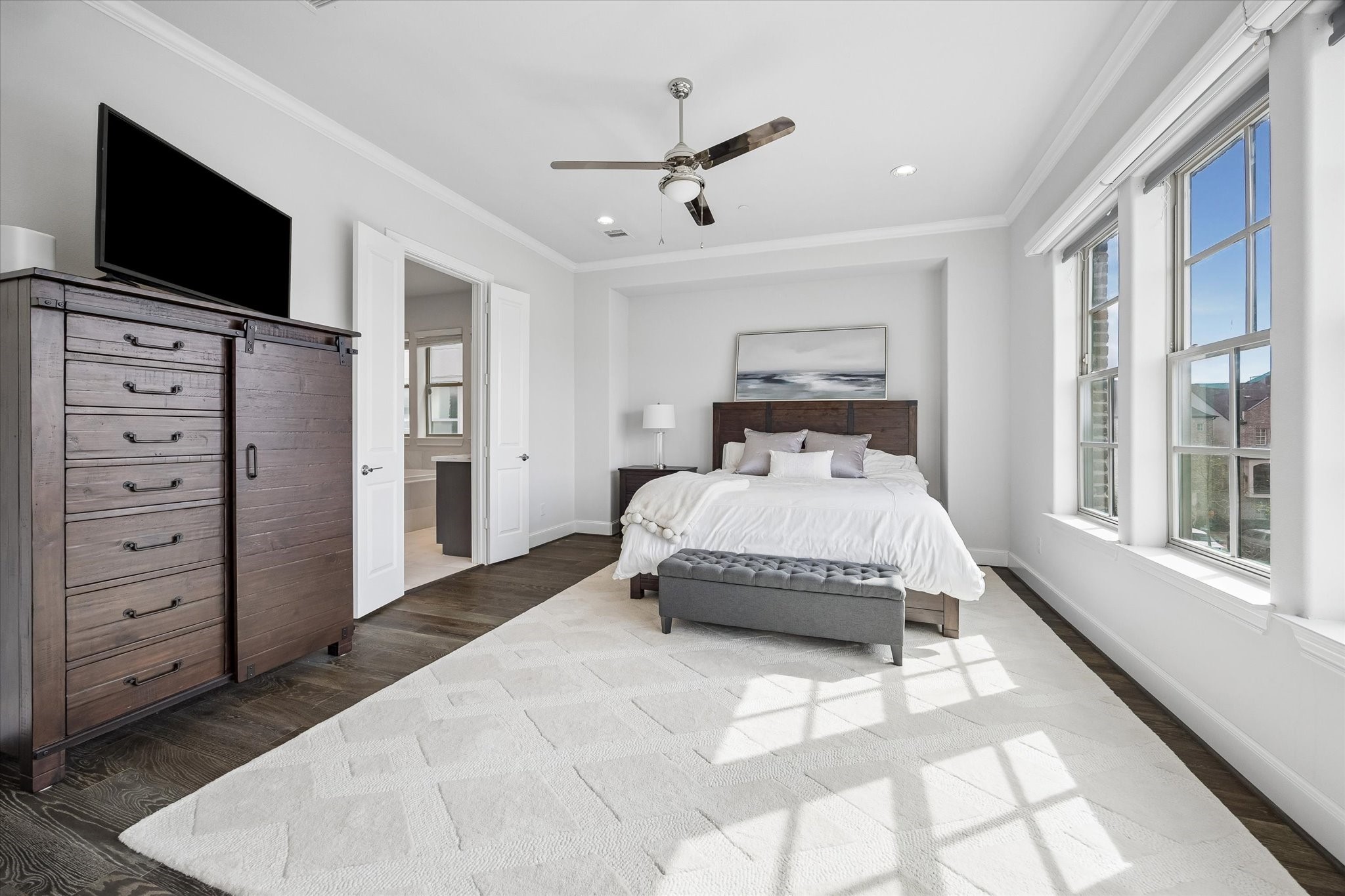 2727 Maxroy Street Houston, TX 77007 - Photo 21 of 46 a spacious bedroom with a bed and a flat screen tv