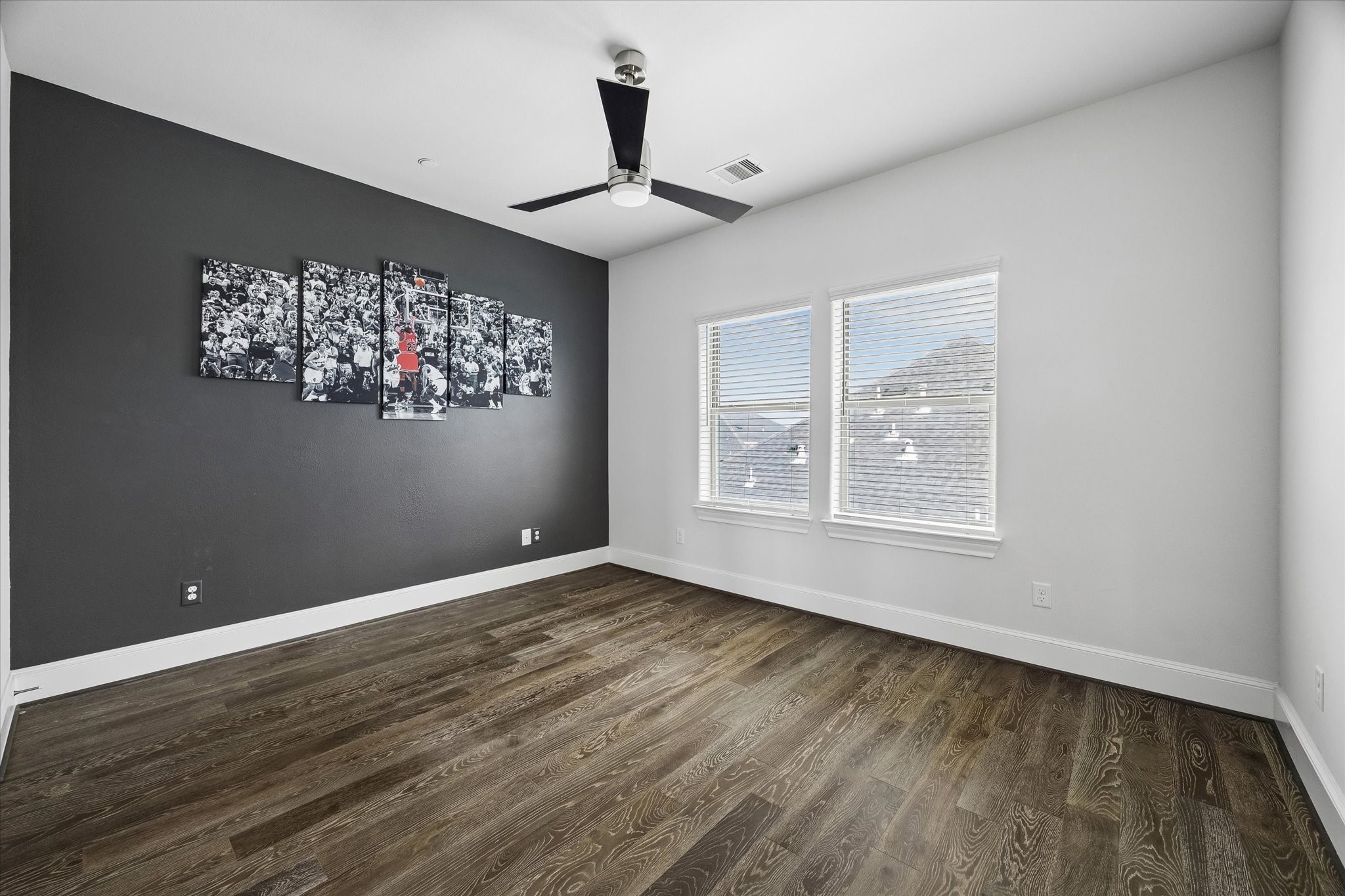 2727 Maxroy Street Houston, TX 77007 - Photo 32 of 46 a view of an empty room with window and wooden floor