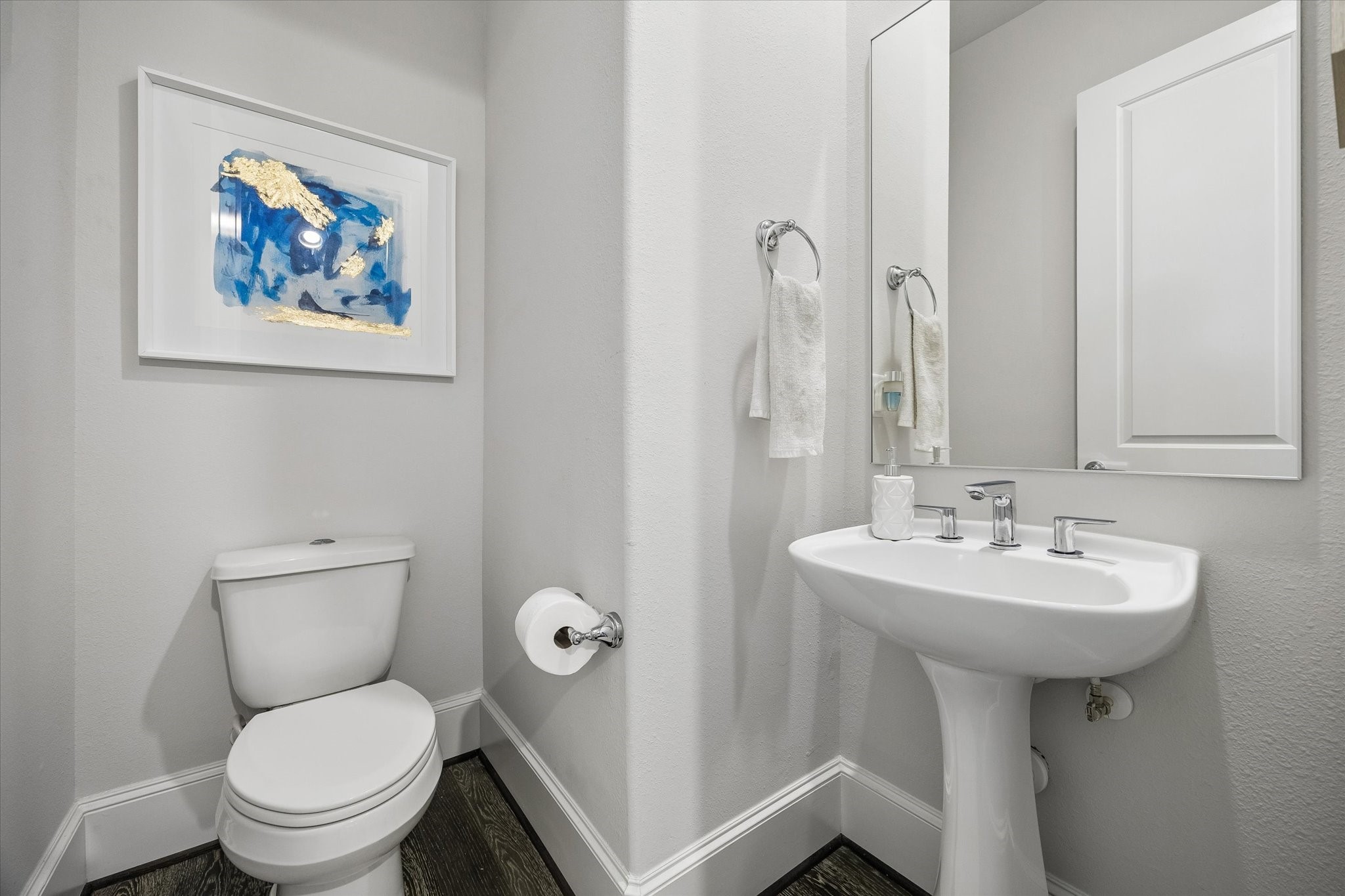 2727 Maxroy Street Houston, TX 77007 - Photo 34 of 46 a bathroom with a toilet sink and mirror