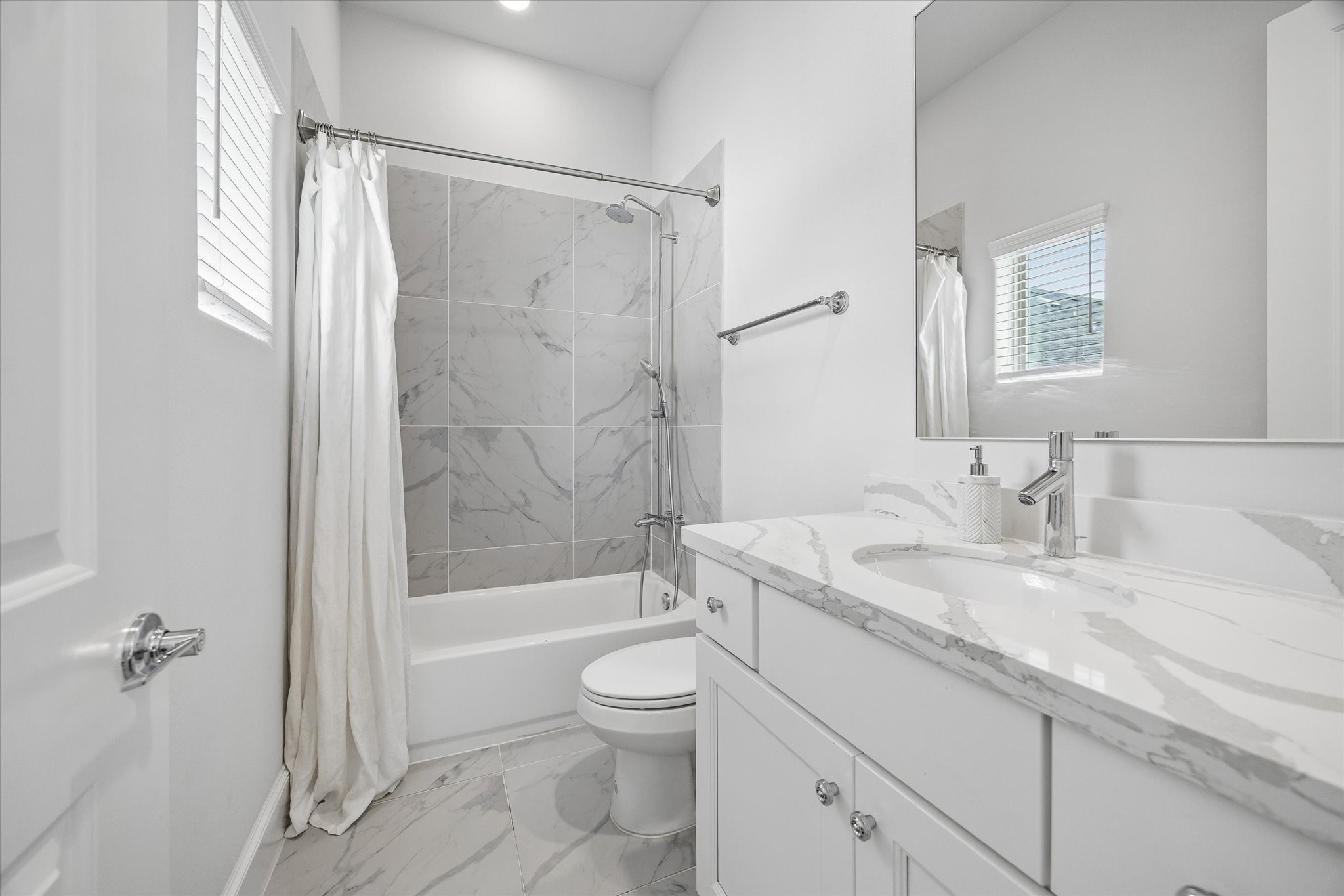 2727 Maxroy Street Houston, TX 77007 - Photo 35 of 46 a bathroom with a granite countertop sink a toilet and shower