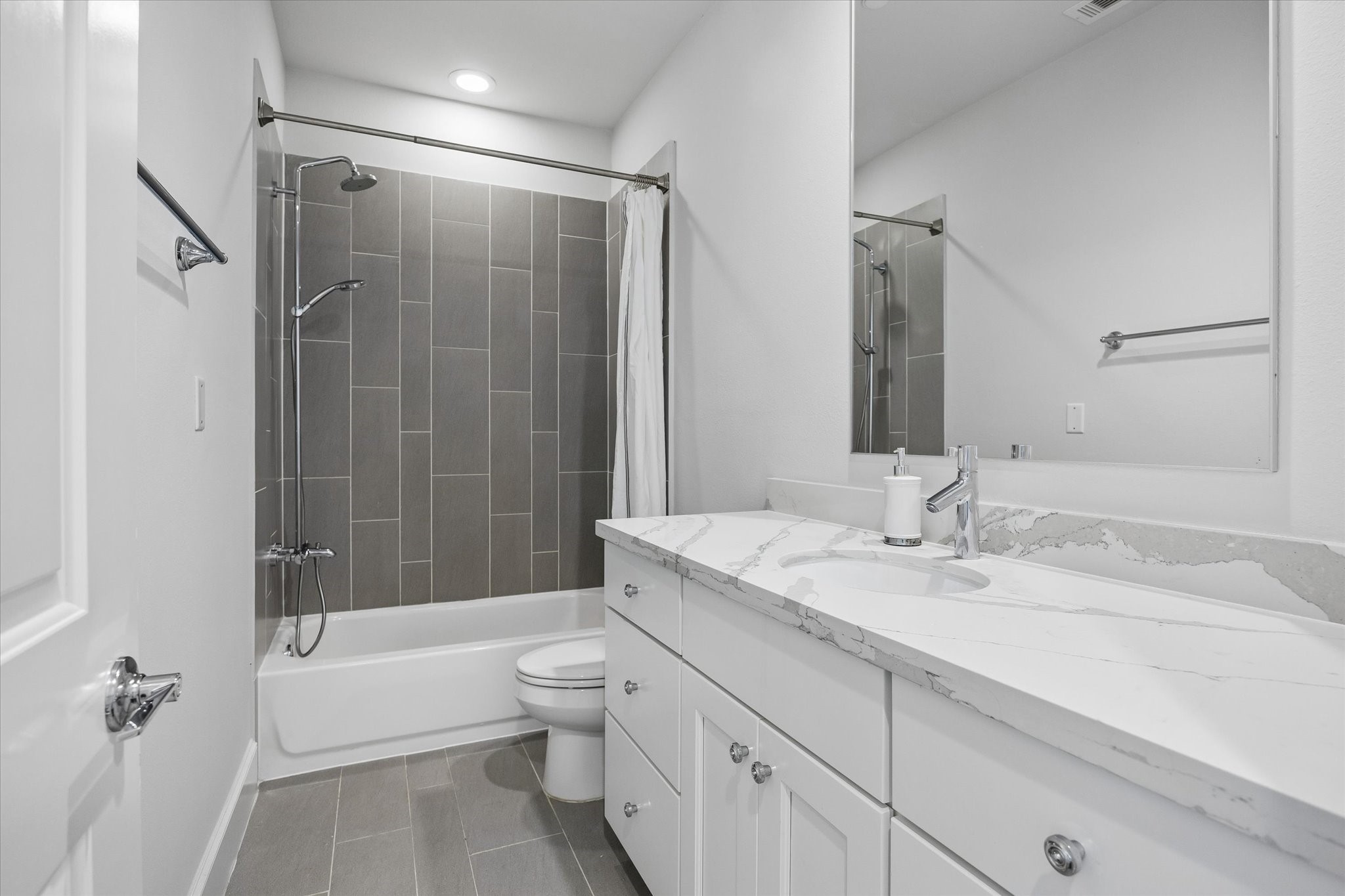 2727 Maxroy Street Houston, TX 77007 - Photo 36 of 46 a bathroom with a granite countertop sink toilet tub and shower