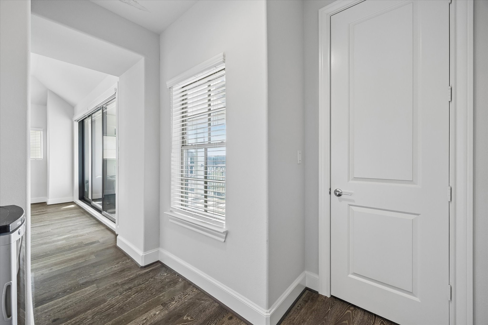 2727 Maxroy Street Houston, TX 77007 - Photo 38 of 46 a view of an empty room with wooden floor and a window