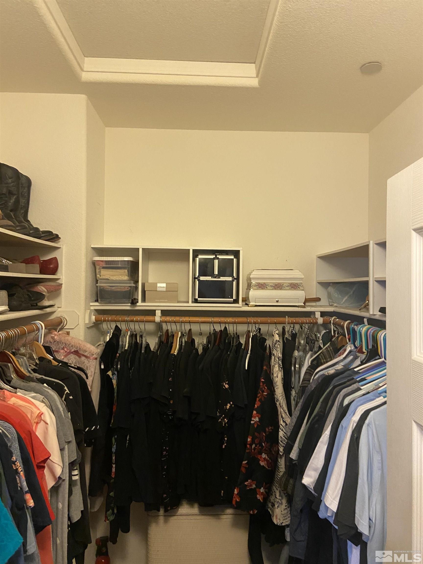 1872 Wind Ranch Road, Unit B Reno, NV 89521 - Photo 9 of 25 a view of walk in closet with clothes and shoes