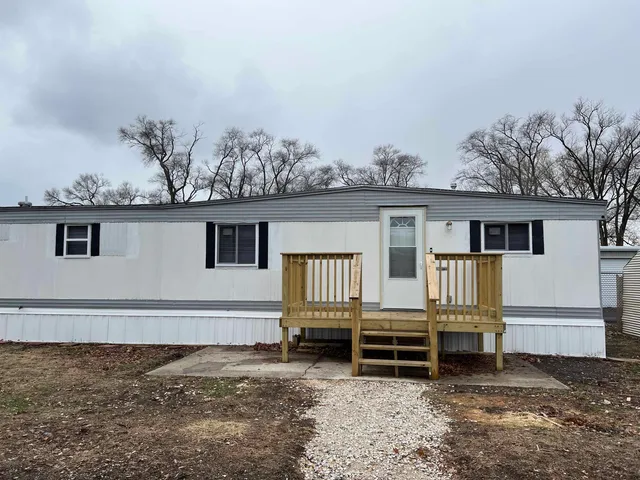 front view of a house with a fence