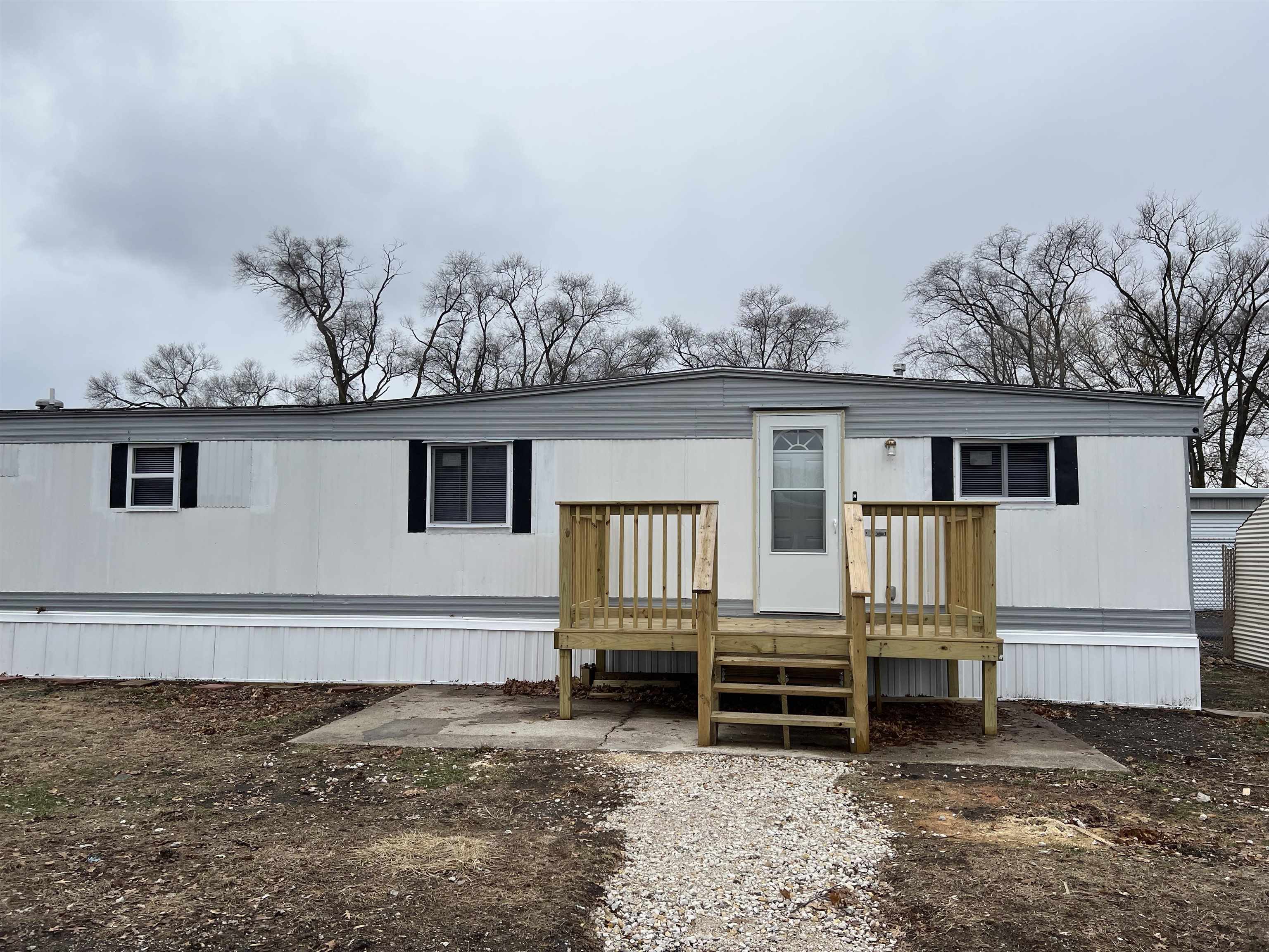 front view of a house with a fence