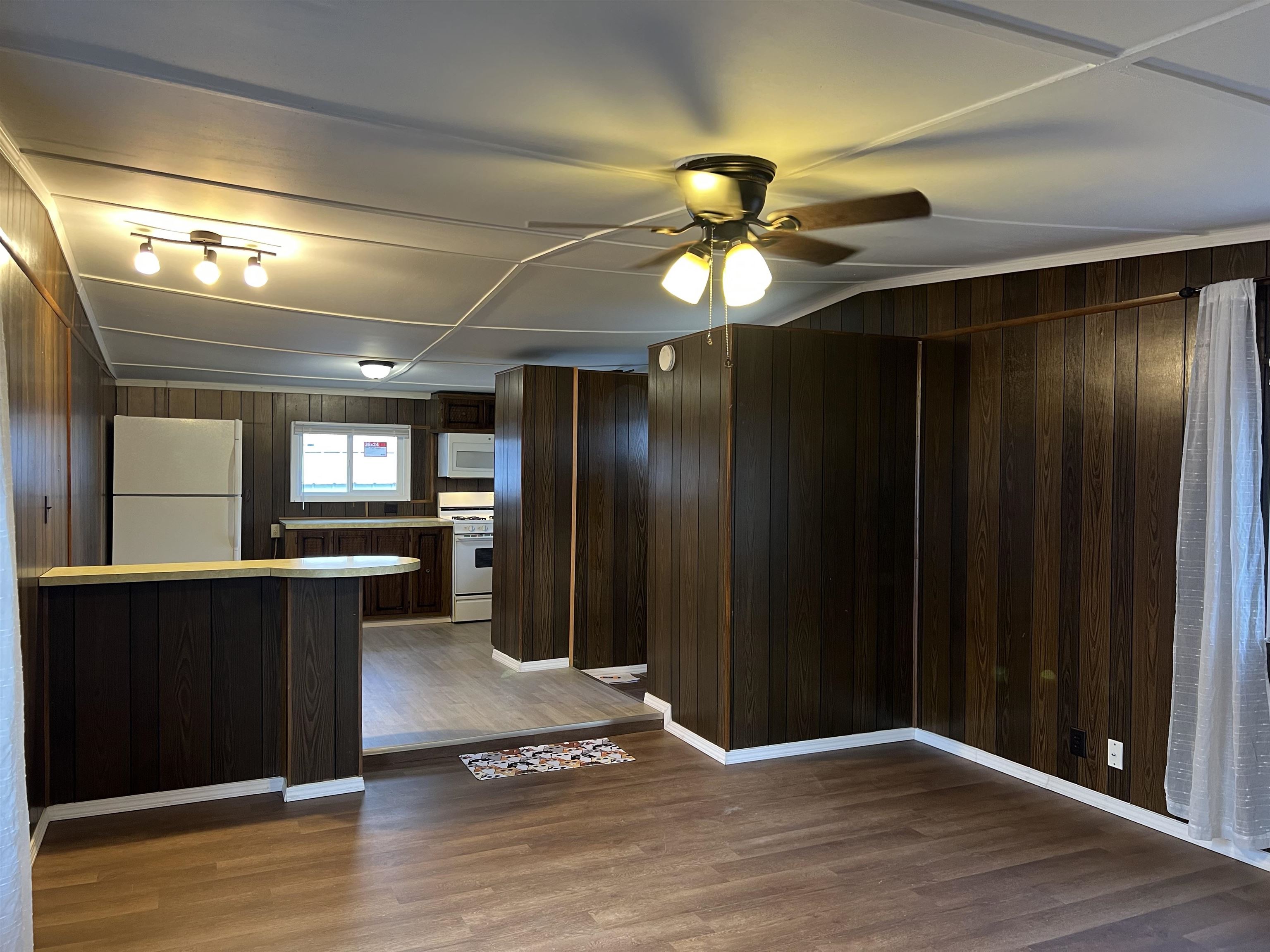 2107 Rivington Road Loves Park, IL 61111 - Photo 5 of 18 a view of a livingroom with a chandelier