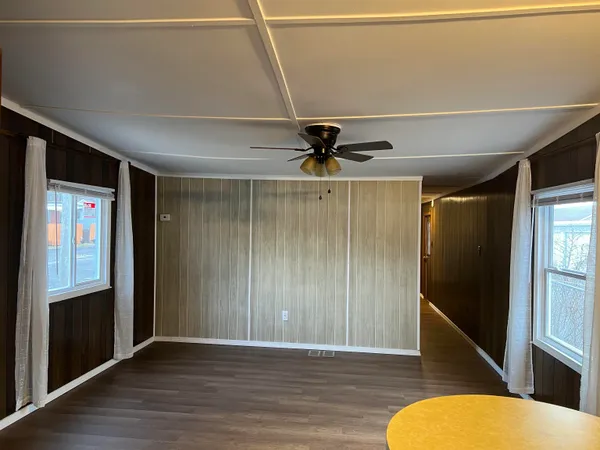 a view of an entryway with wooden floor