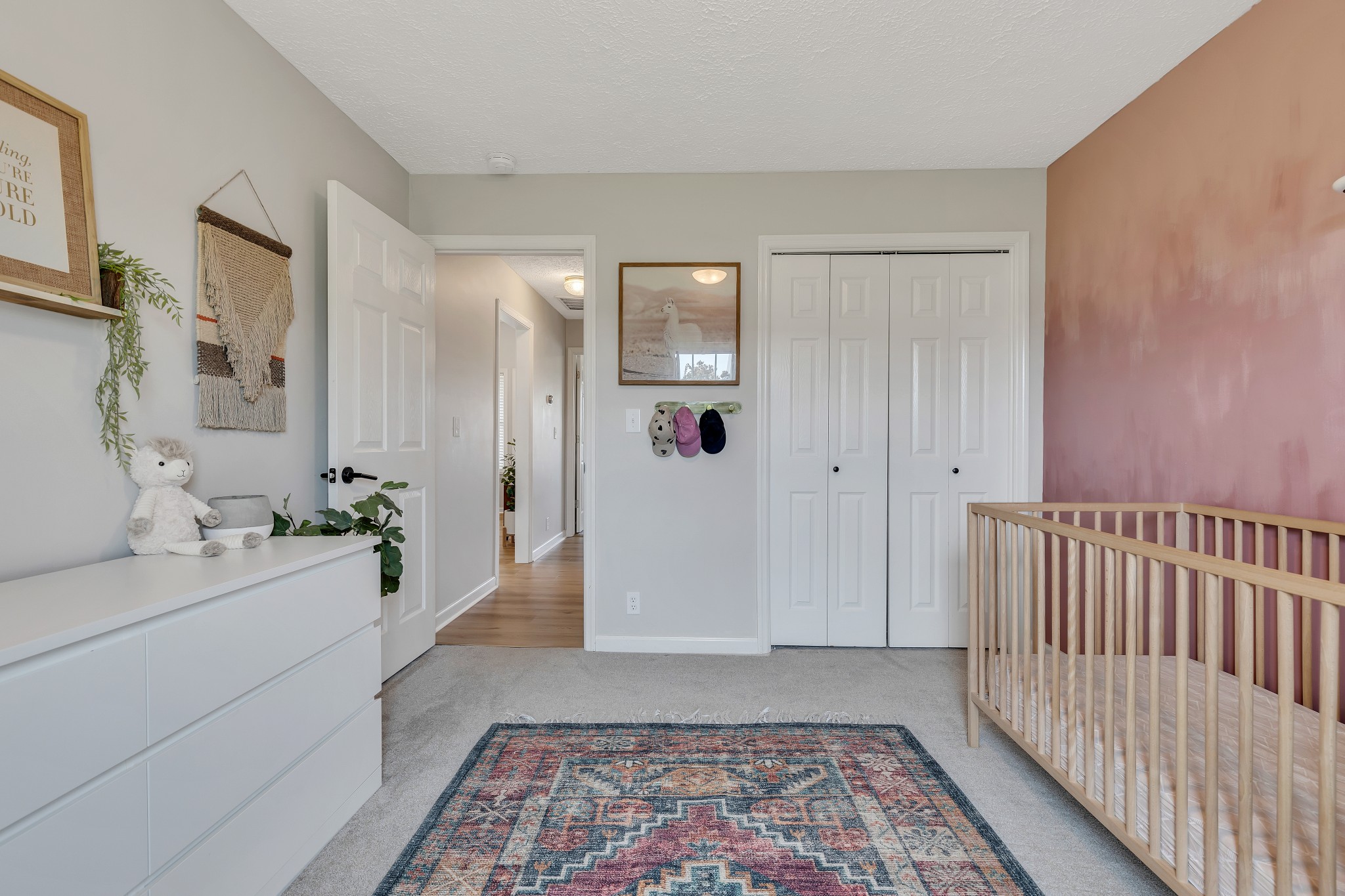 1213 Hunters Point Lane Spring Hill, TN 37174 - Photo 18 of 30 a hallway with a white door and a bathroom