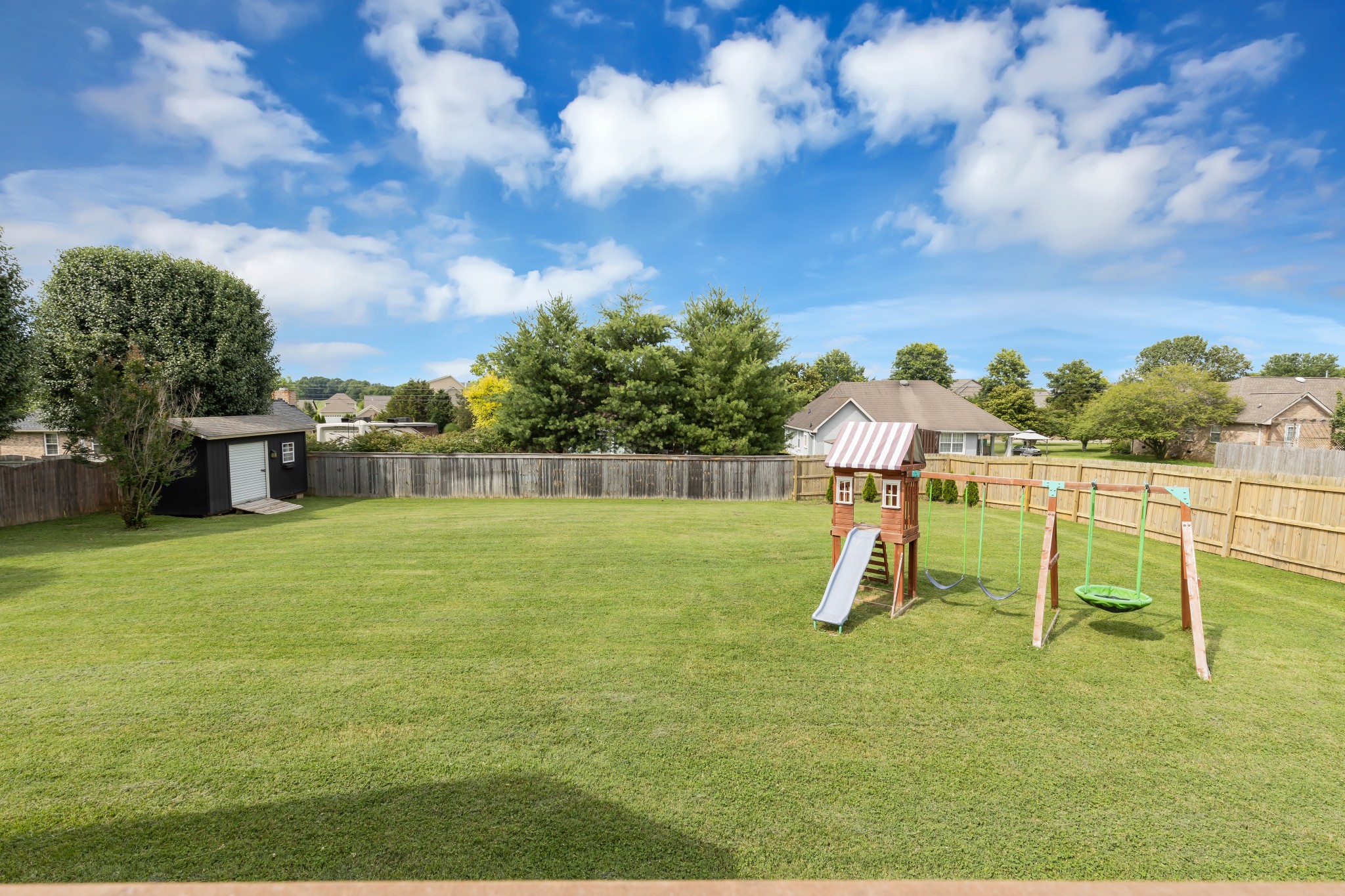 1213 Hunters Point Lane Spring Hill, TN 37174 - Photo 26 of 30 a backyard of a house with lots of green space