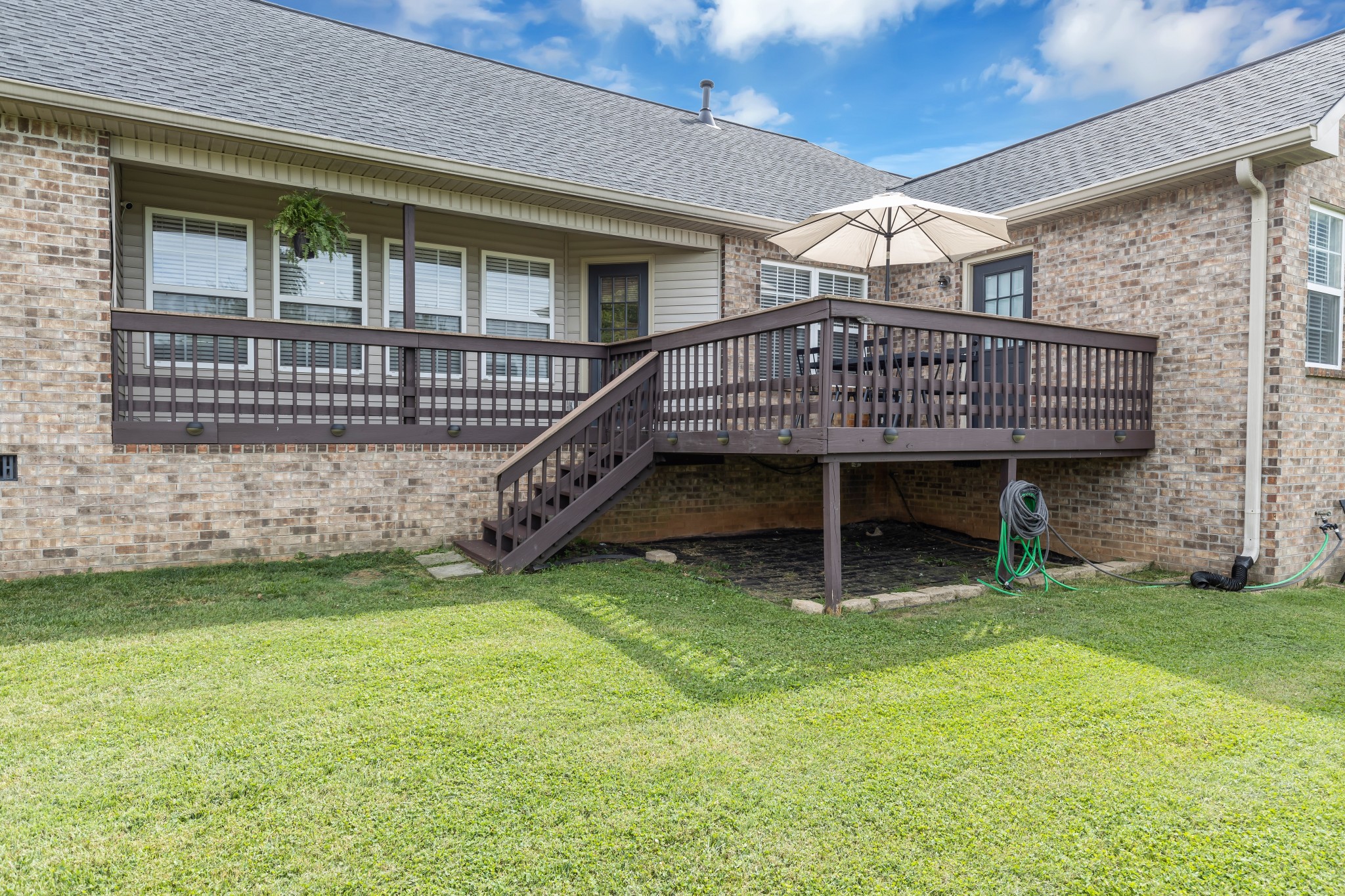1213 Hunters Point Lane Spring Hill, TN 37174 - Photo 29 of 30 a view of a house with a yard and deck