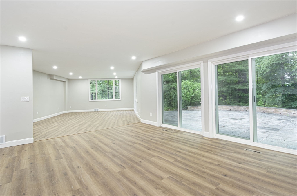 32 Aylesbury Road Worcester, MA 01609 - Photo 14 of 42 a view of an empty room with wooden floor and a window
