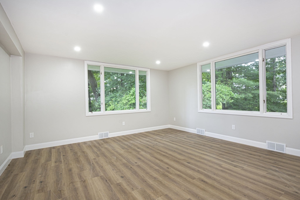 32 Aylesbury Road Worcester, MA 01609 - Photo 16 of 42 a view of an empty room with wooden floor and a window