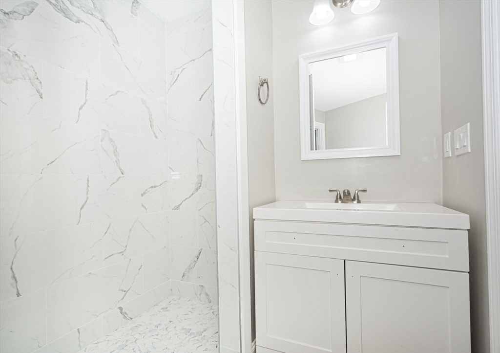 32 Aylesbury Road Worcester, MA 01609 - Photo 21 of 42 a bathroom with a sink and a mirror