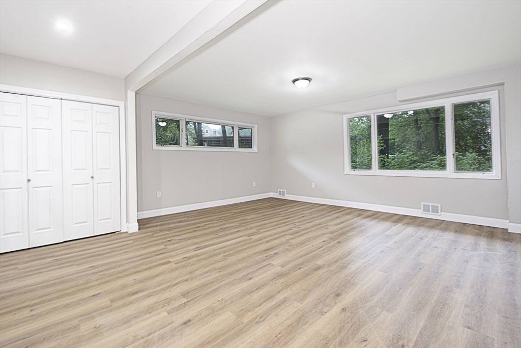 32 Aylesbury Road Worcester, MA 01609 - Photo 22 of 42 an empty room with wooden floor and windows