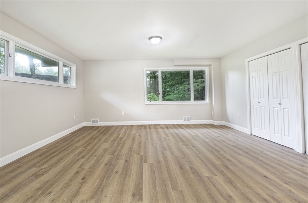 32 Aylesbury Road Worcester, MA 01609 - Photo 24 of 42 a view of an empty room with wooden floor and a window