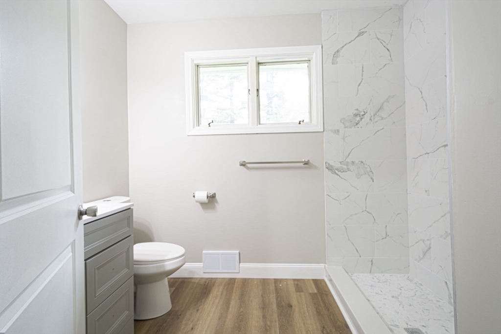 32 Aylesbury Road Worcester, MA 01609 - Photo 25 of 42 a bathroom with a toilet and a shower