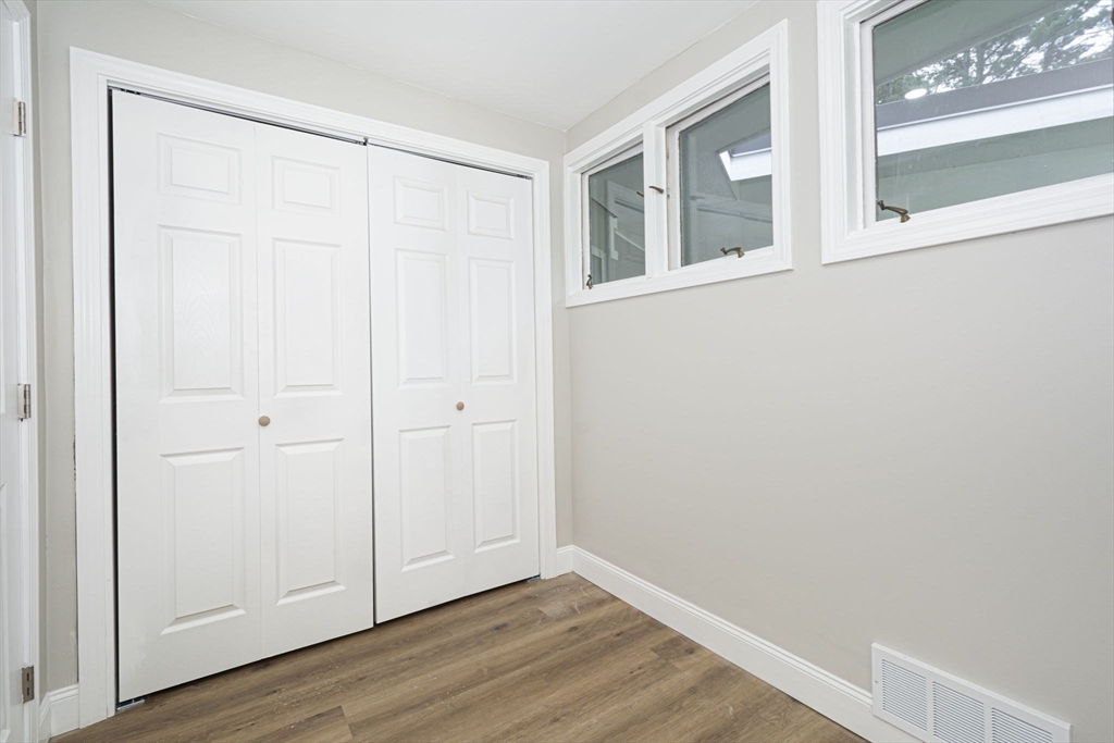 32 Aylesbury Road Worcester, MA 01609 - Photo 27 of 42 a view of an empty room with wooden floor and a window
