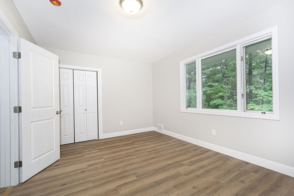 32 Aylesbury Road Worcester, MA 01609 - Photo 30 of 42 a view of an empty room with wooden floor and a window