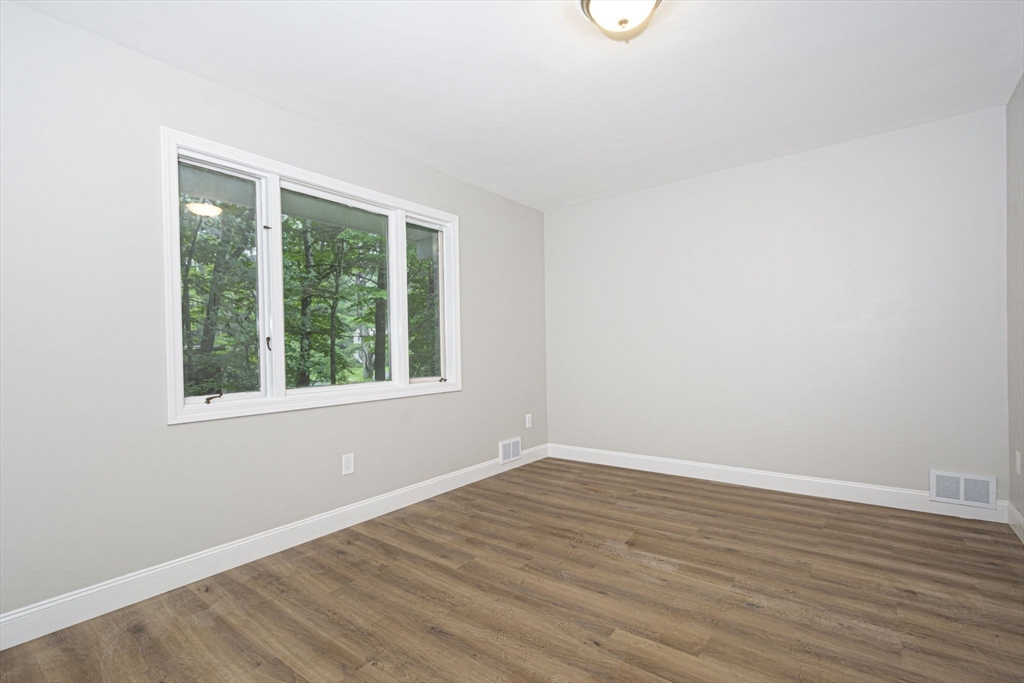 32 Aylesbury Road Worcester, MA 01609 - Photo 31 of 42 an empty room with wooden floor and windows
