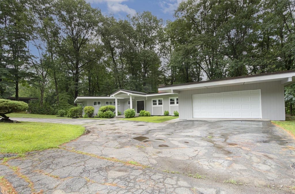 32 Aylesbury Road Worcester, MA 01609 - Photo 4 of 42 a view of a house with a yard and large trees