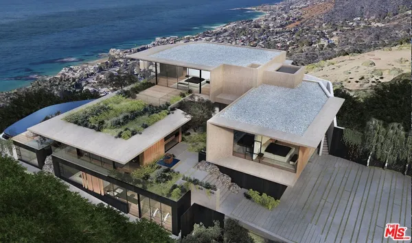 an aerial view of a house roof deck with chairs and wooden floor