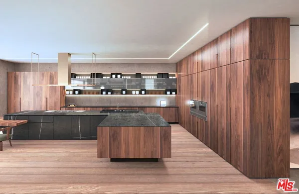 a kitchen with stainless steel appliances granite countertop a wooden cabinets and a wooden floor