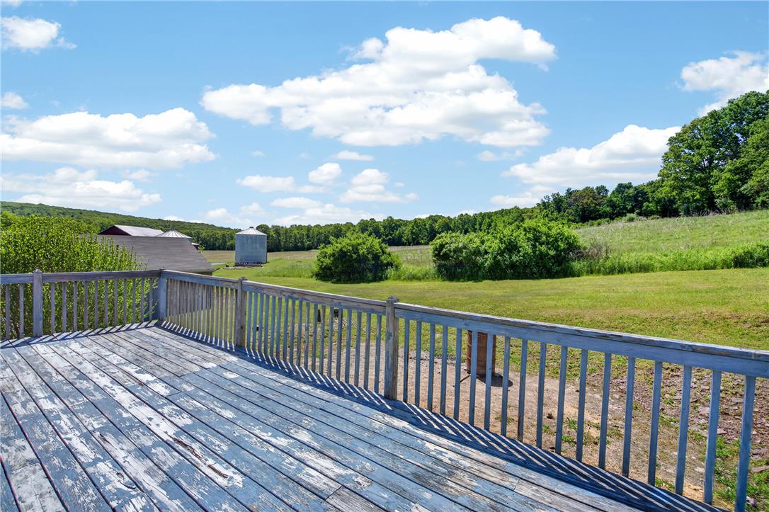 62 Stoney Road Tamaqua, PA 18252 - Photo 24 of 61 A rustic deck provides pastoral views of green fields and a distant silo.