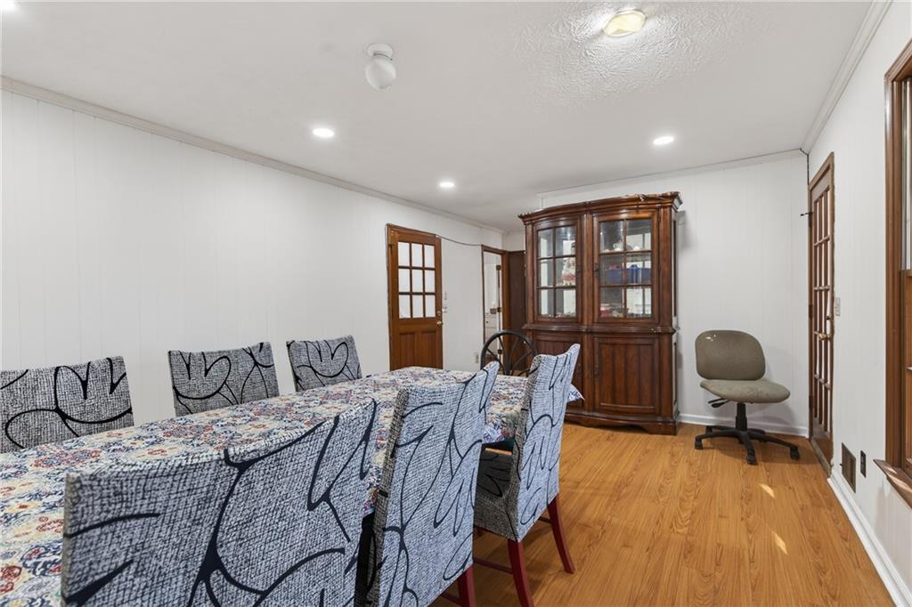 6728 Angels Lane Tucker, GA 30084 - Photo 13 of 54 a bedroom with a bed and wooden floor