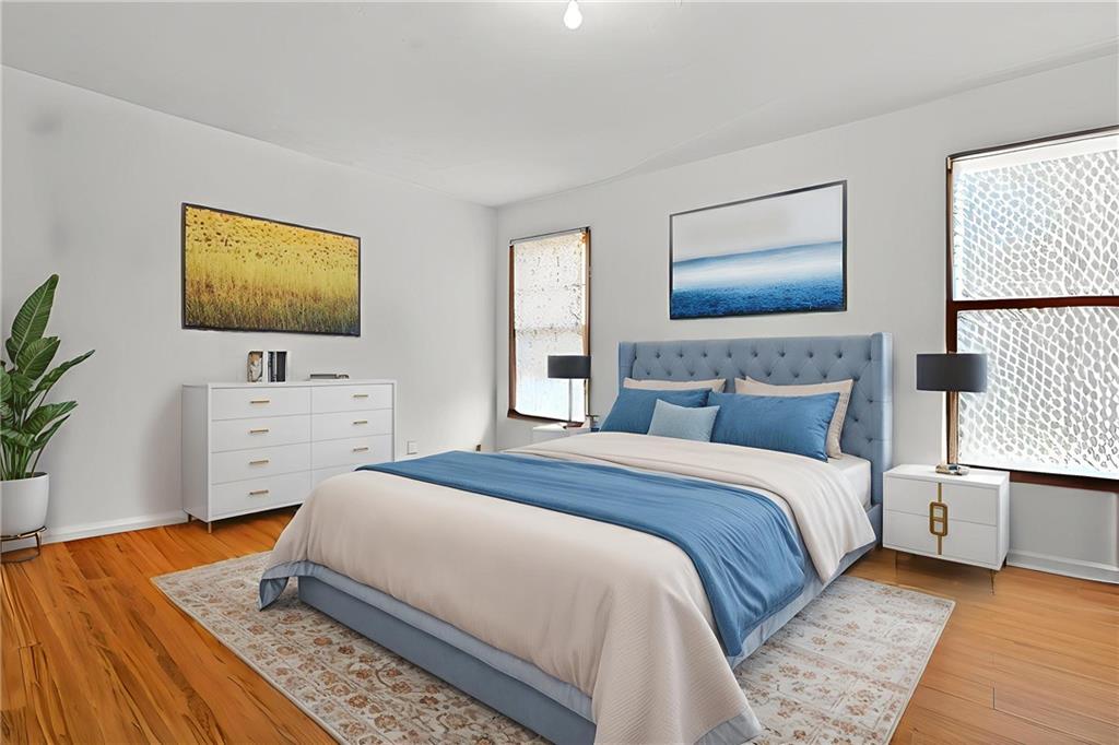 6728 Angels Lane Tucker, GA 30084 - Photo 22 of 54 a bedroom with a bed and a flat screen tv