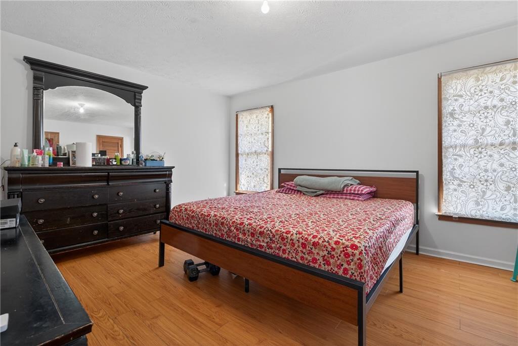 6728 Angels Lane Tucker, GA 30084 - Photo 24 of 54 a bedroom with a bed and a dresser