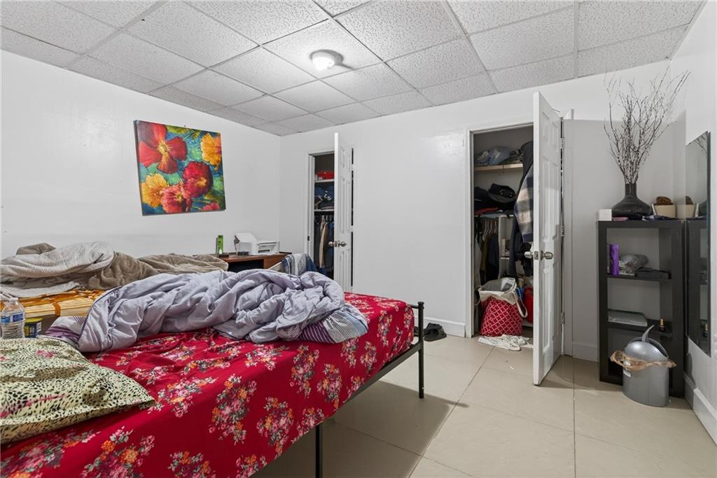 6728 Angels Lane Tucker, GA 30084 - Photo 28 of 54 a bed room with a bed and a couch