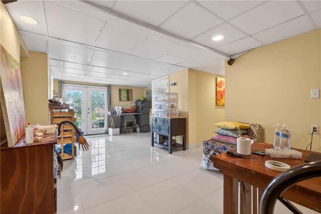 6728 Angels Lane Tucker, GA 30084 - Photo 30 of 54 a view of a workspace with furniture and a livingroom