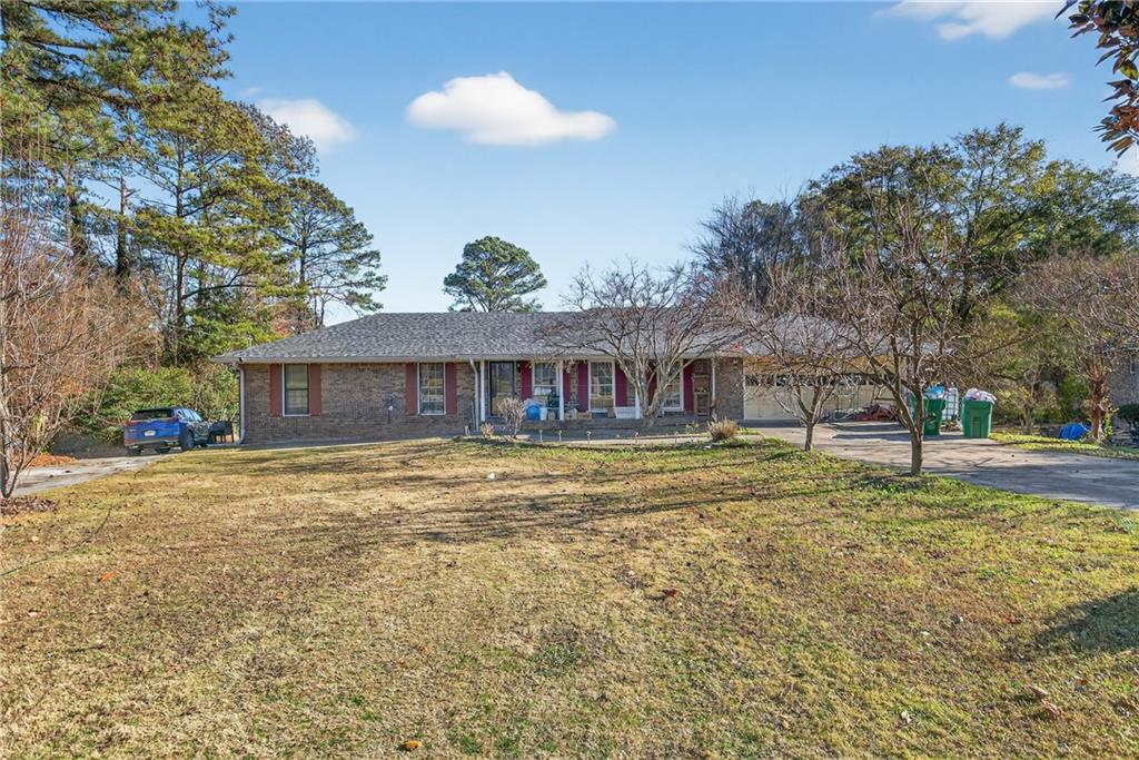 6728 Angels Lane Tucker, GA 30084 - Photo 3 of 54 a front view of a house with a yard