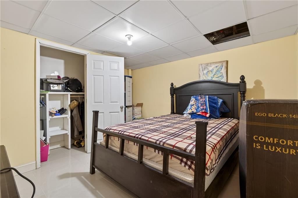 6728 Angels Lane Tucker, GA 30084 - Photo 33 of 54 a bedroom with a bed and a tv in it