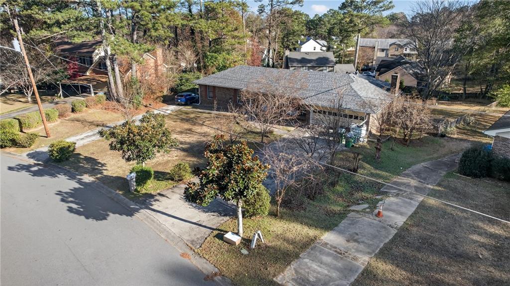 6728 Angels Lane Tucker, GA 30084 - Photo 37 of 54 a view of a yard with cars