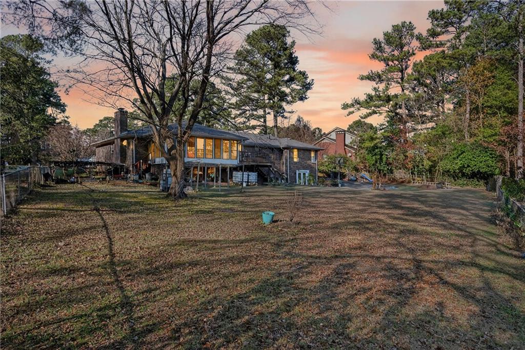 6728 Angels Lane Tucker, GA 30084 - Photo 38 of 54 a front view of a house with a yard
