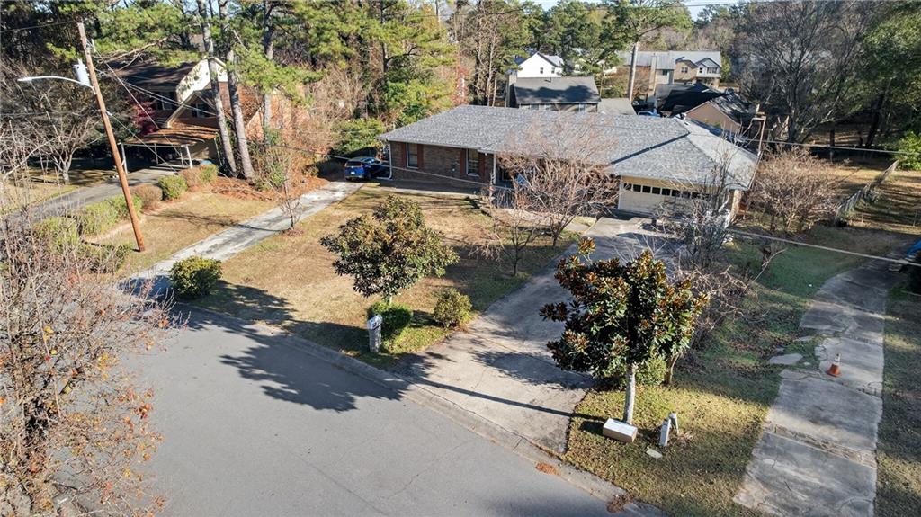 6728 Angels Lane Tucker, GA 30084 - Photo 39 of 54 a view of a yard and front view of a house