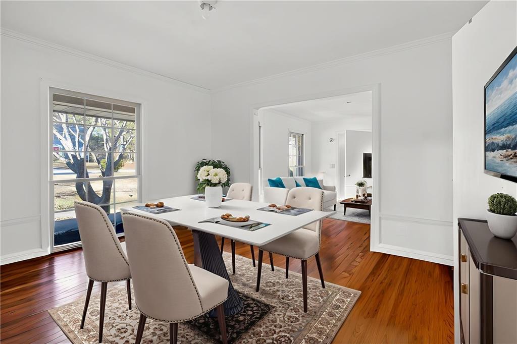 6728 Angels Lane Tucker, GA 30084 - Photo 4 of 54 a view of a dining room with furniture window and wooden floor