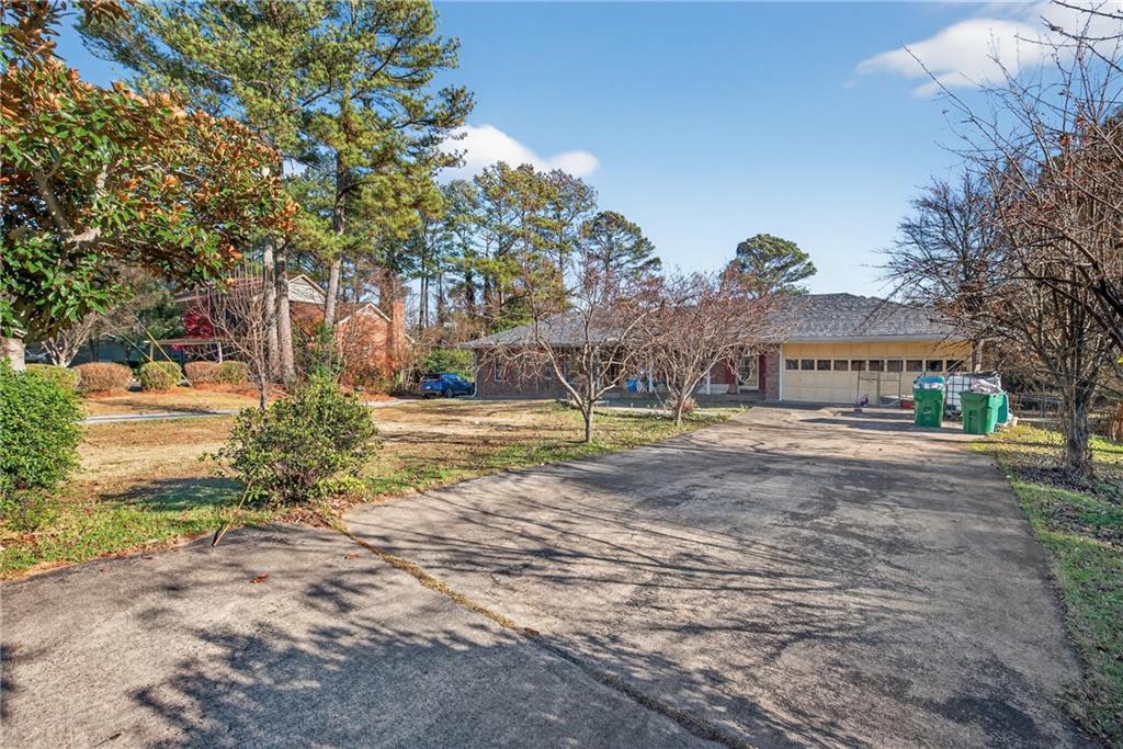 6728 Angels Lane Tucker, GA 30084 - Photo 45 of 54 a view of house with outdoor space and sitting area