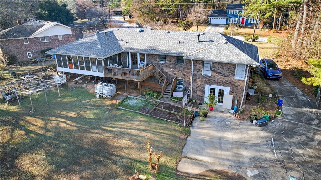 6728 Angels Lane Tucker, GA 30084 - Photo 46 of 54 a aerial view of a house with swimming pool