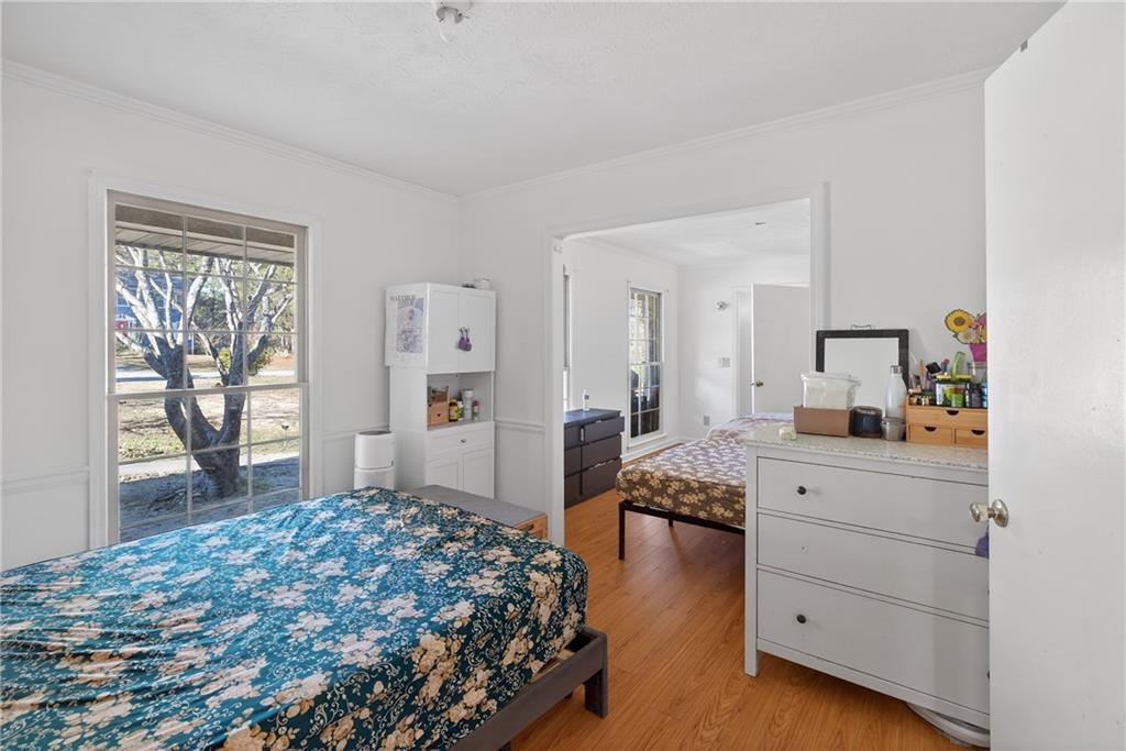 6728 Angels Lane Tucker, GA 30084 - Photo 10 of 54 a bedroom with a bed and a dresser